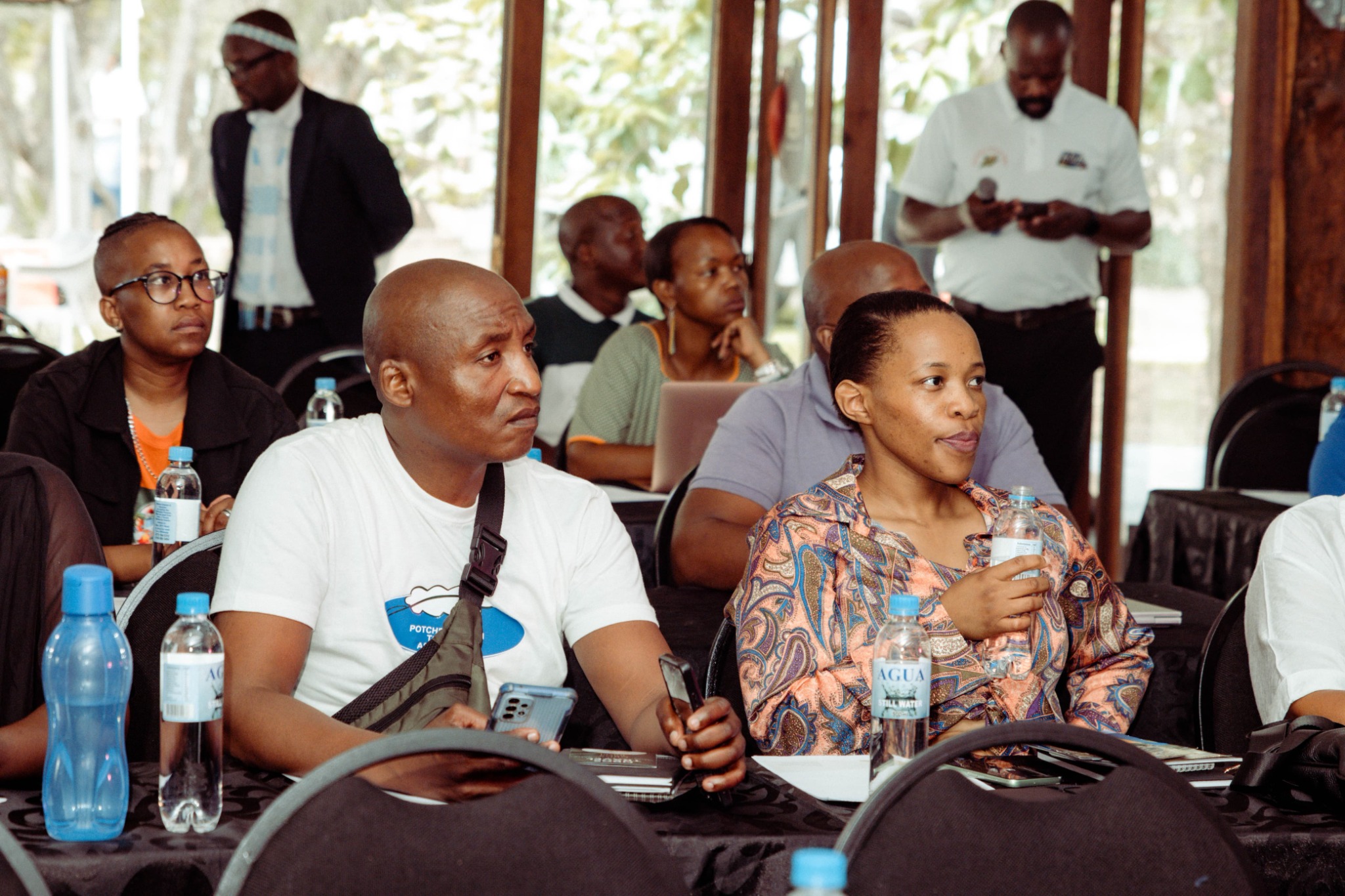 Attendees listening during a SATOVITO gathering